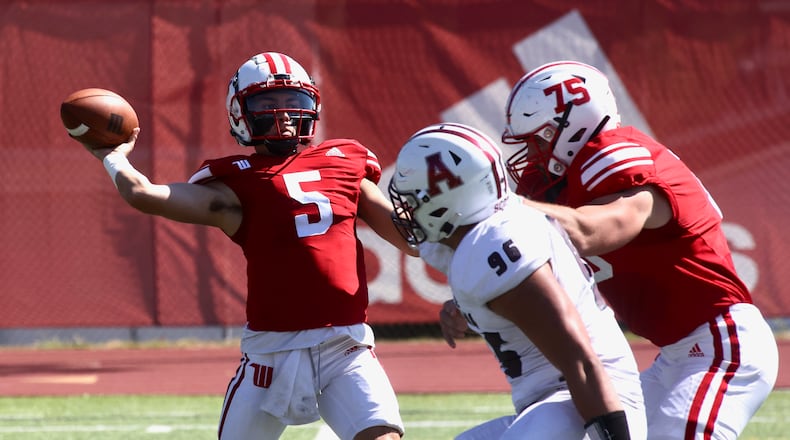 Wittenberg's Max Milton throws a pass against Alma on Saturday, Sept. 23, 2023, at Edwards-Maurer Field in Springfield. David Jablonski/Staff
