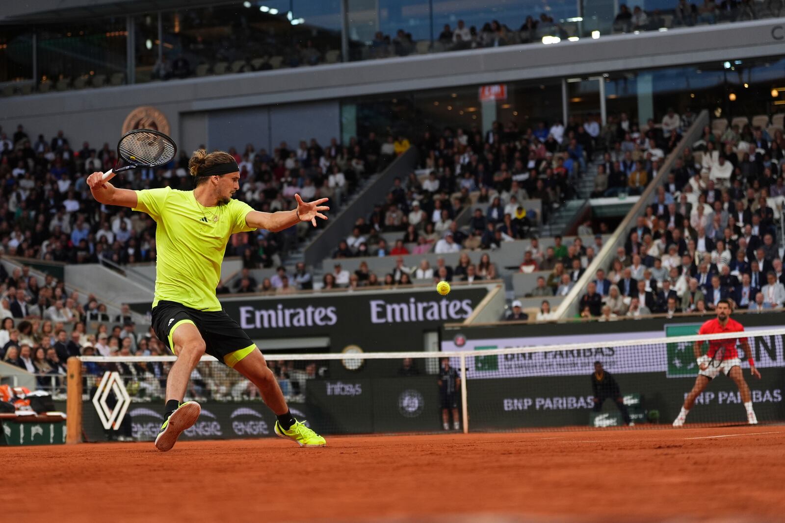 Germany's Alexander Zverev plays a shot against Serbia's Novak Djokovic during their quarterfinal match of the French Tennis Open at the Roland-Garros stadium in Paris, Wednesday, June 4, 2025. (AP Photo/Lindsey Wasson)