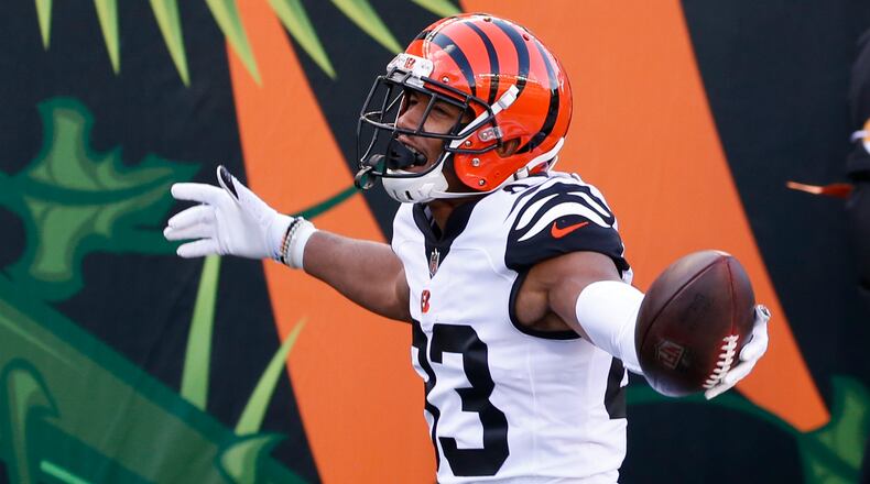 Cincinnati Bengals' Tyler Boyd (83) celebrates a touchdown reception during the second half of an NFL football game against the Tennessee Titans, Sunday, Nov. 1, 2020, in Cincinnati. (AP Photo/Gary Landers)