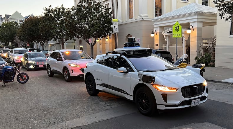 FILE - A Waymo driverless taxi stops on a street in San Francisco on Feb. 15, 2023. (AP Photo/Terry Chea, File)