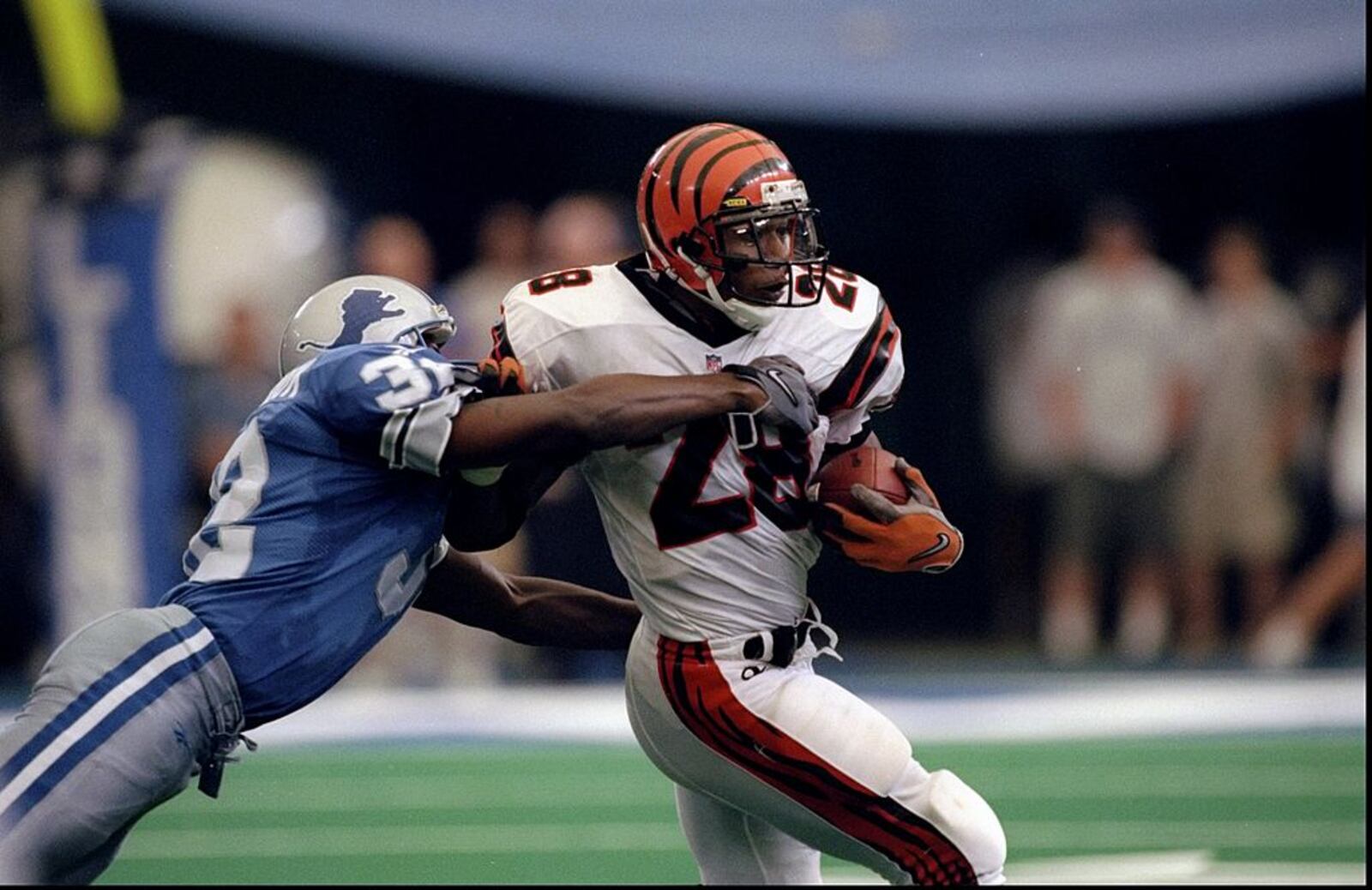 13 Sep 1998: Running back Corey Dillon #28 of the Cincinnati Bengals in action during a game against the Detroit Lions at the Pontiac Silverdome in Pontiac, Michigan. The Bengals defeated the Lions 34-28. Mandatory Credit: Vincent Laforet /Allsport