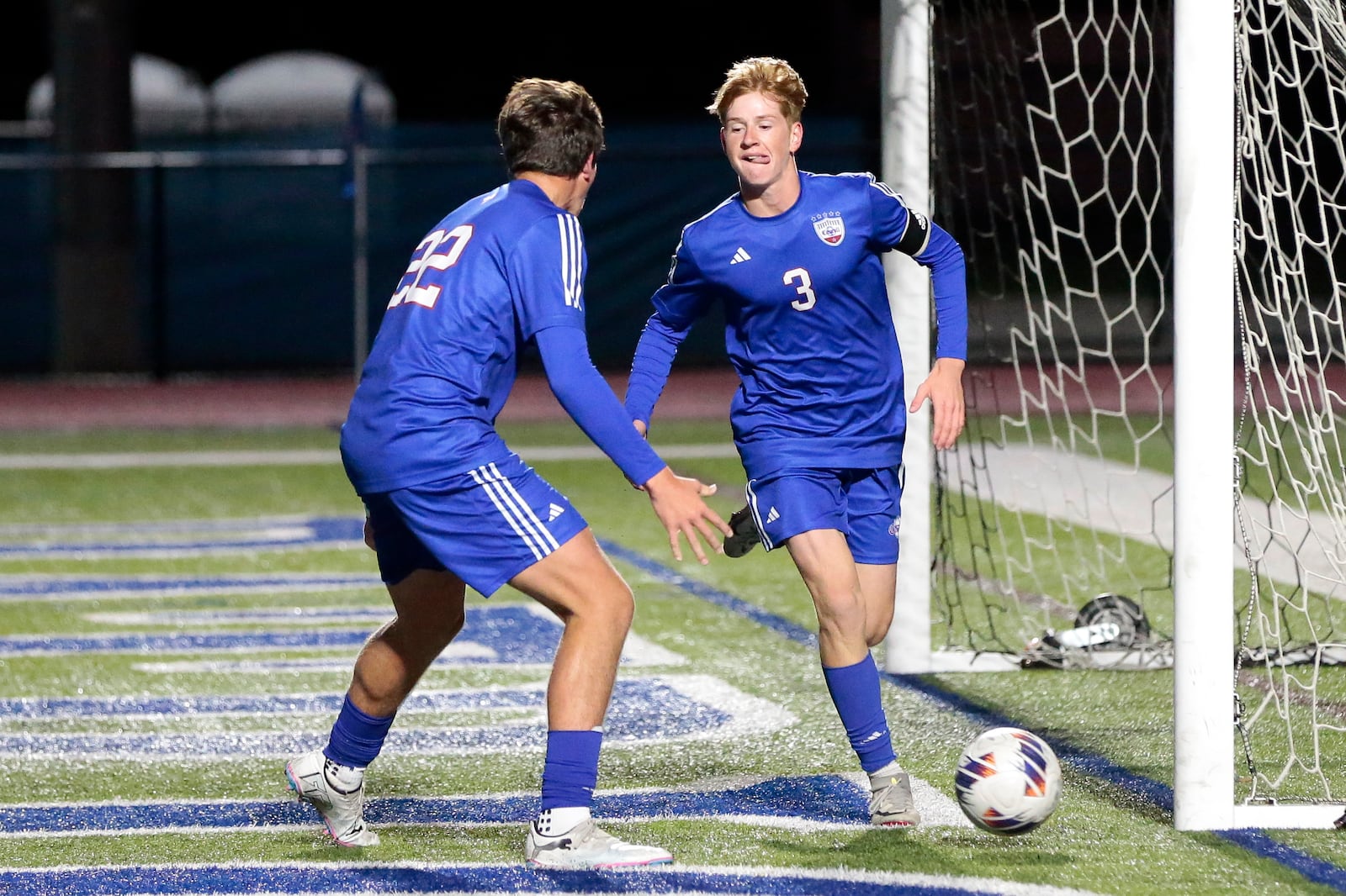 Carroll High School senior Noah Haggerty (right) and junior Luke Tokarz celebrate after scoring a goal during their 8-0 victory over Franklin in a Division III district semifinal on Tuesday, Oct. 21 at Spoerl-Bartlett Field. STEVEN WRIGHT / STAFF