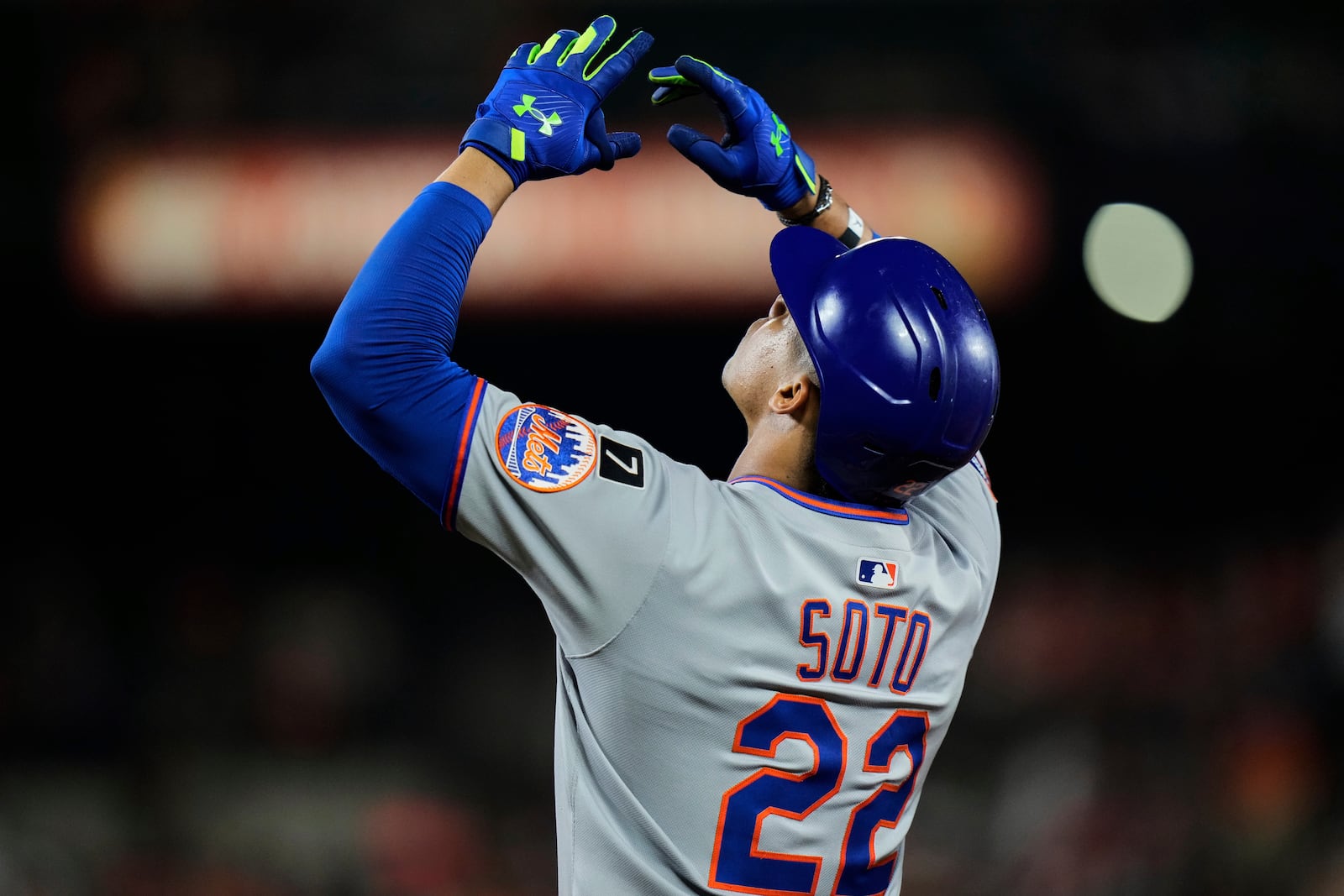 New York Mets' Juan Soto (22) reacts after hitting an RBI single to score Francisco Lindor during the 10th inning of a baseball game against the Baltimore Orioles, Tuesday, July 8, 2025, in Baltimore. (AP Photo/Stephanie Scarbrough)