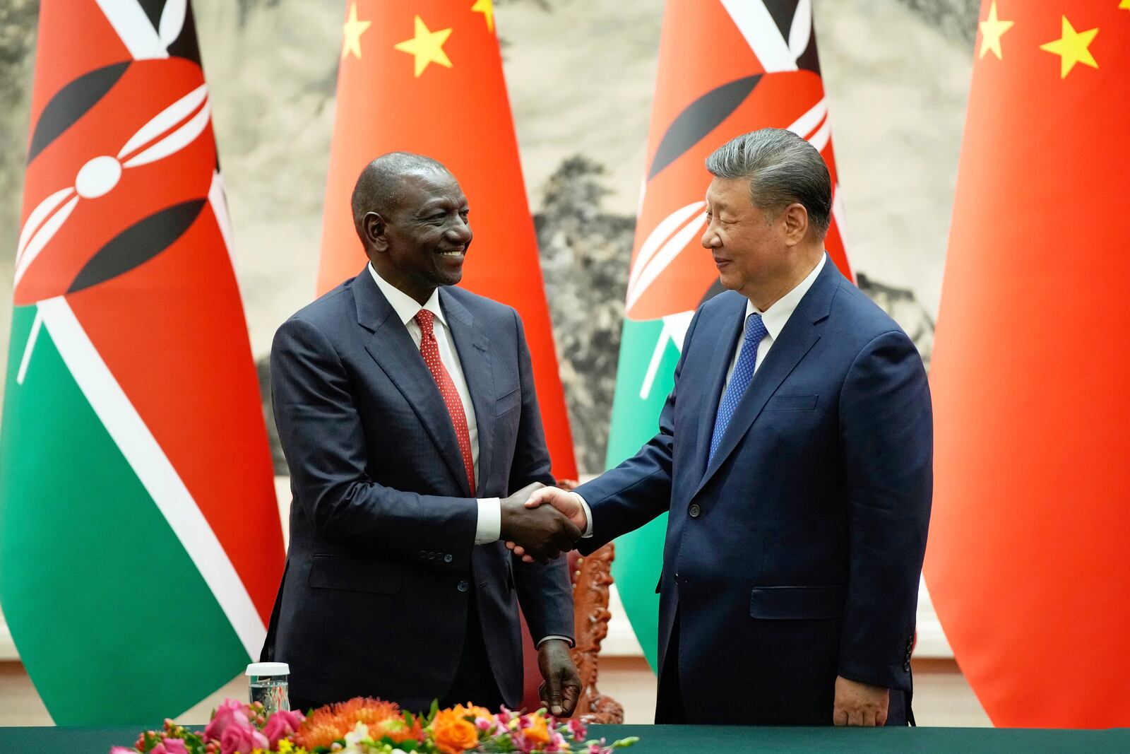 FILE - Chinese President Xi Jinping, right, and Kenyan President William Ruto shake hands during a signing ceremony at the Great Hall of the People in Beijing, April 24, 2025. (Iori Sagisawa/Pool Photo via AP, File)