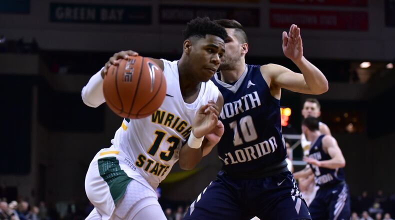 Wright State’s Malachi Smith tries to drive past North Florida’s Ivan Gandia-Rosa during Saturday’s game at the Nutter Center. Joseph Craven/CONTRIBUTED