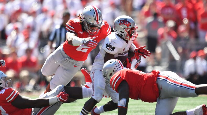 COLUMBUS, OH - SEPTEMBER 23: Chase Young #2 of the Ohio State Buckeyes dives to make a tackle on Lexington Thomas of the UNLV Rebels in the second quarter at Ohio Stadium on September 23, 2017 in Columbus, Ohio. (Photo by Jamie Sabau/Getty Images)