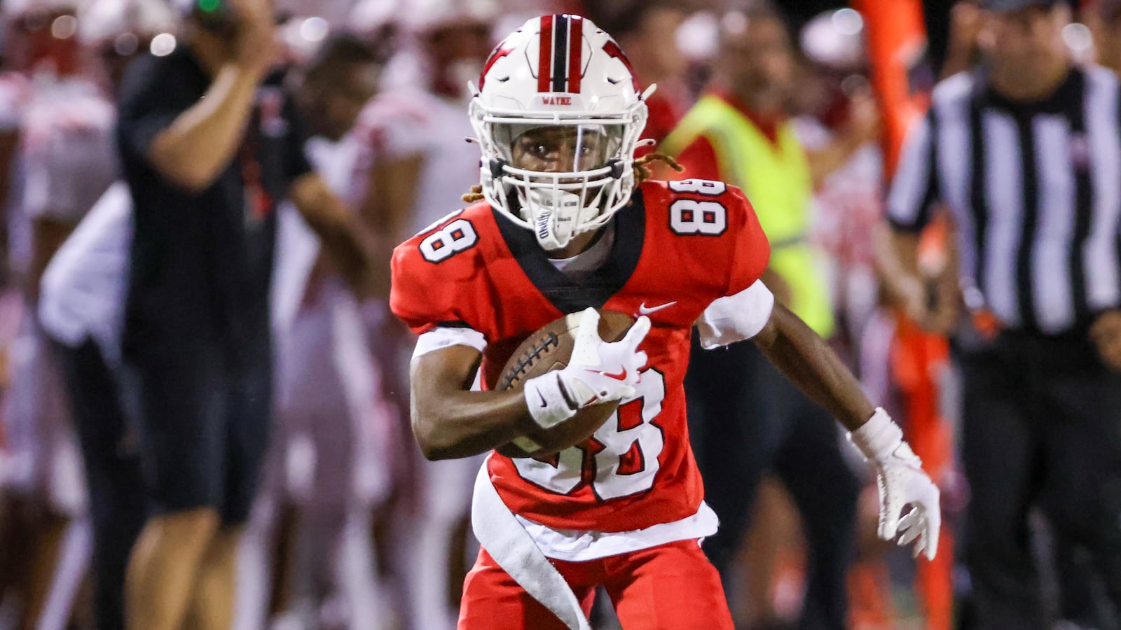 Wayne sophomore receiver James Dyer IV runs after catching a pass during a 39-yard TD reception late in the fourth quarter of a nonconference game against Fairfield on Friday. Aug. 22 in Huber Heights. Dyer's TD made the difference in a 31-24 win. BRYANT BILLING / STAFF