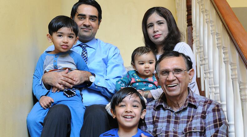 The Bhatti Household has three generations, top row, Rohaan, age 3, Rooshan, Romeesa, 7 months, Rabia. Bottom row, Roobash, 5 and Mohammad Bhatti, 76. MARSHALL GORBY\STAFF