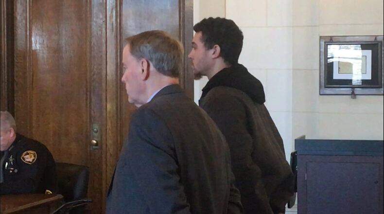 Cody Mauller, right, stands while being sentenced in Clark County Common Pleas Court.