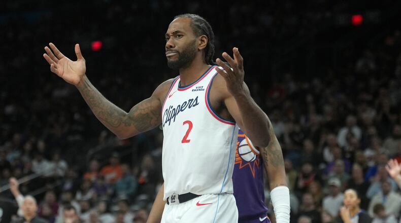 Los Angeles Clippers forward Kawhi Leonard looks for a foul to be called by officials during the second half of an NBA basketball game against the Phoenix Suns Sunday, Feb. 1, 2026, in Phoenix. (AP Photo/Ross D. Franklin)