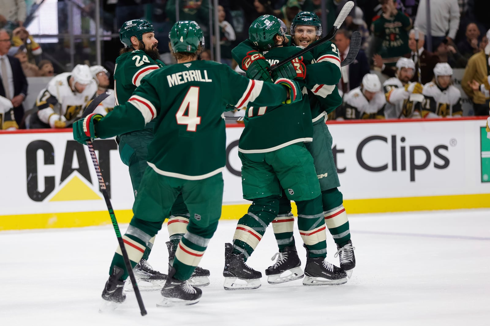 Minnesota Wild right wing Ryan Hartman, right, celebrates with teammates after scoring during the first period of Game 6 of a first-round NHL hockey playoff series against the Vegas Golden Knights, Thursday, May 1, 2025, in St. Paul, Minn. (AP Photo/Bailey Hillesheim)
