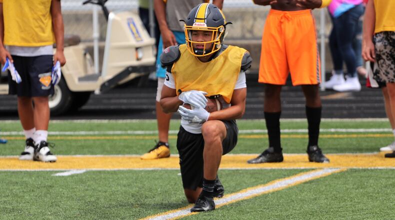 Springfield High School senior wide receiver Michael Brown-Stephens stretches during warmups on Thursday, Aug. 4. Brown-Stephens announced earlier in the week he will play collegiately at the University of Minnesota. CONTRIBUTED PHOTO/MICHAEL COOPER
