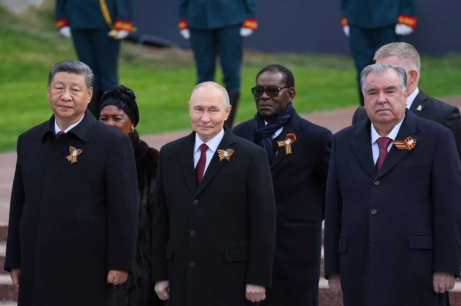 Chinese President Xi Jinpin, left, Russian President Vladimir Putin, centre, Tajikistan's President Emomali Rakhmon, right, and President of the Republic of Congo Denis Sassou Nguesso, centre right, attend a wreath laying ceremony at the Tomb of the Unknown Soldier in Alexander Garden after the Victory Day military parade in Moscow, Russia, Friday, May 9, 2025, during celebrations of the 80th anniversary of the Soviet Union's victory over Nazi Germany during the World War II. (Yuri Kochetkov/Pool Photo via AP)