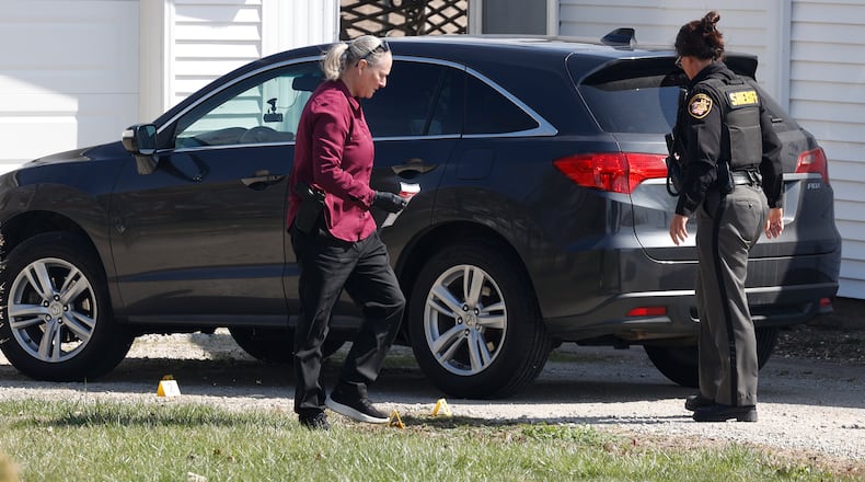 The Clark County Sheriff's Office investigates a shooting at a home in the 7000 block of South Charleston-Clifton Road Monday, March 25, 2024. Deputies arrived at the home to find a woman shot in the driveway and an 81-year-old man with injuries. The woman was flown by MedFlight to Kettering Health Main Campus, where she later died, while the man was transported to the hospital by medic. BILL LACKEY/STAFF