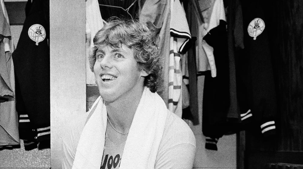 FILE - Yankee pitcher Ken Clay smiles in the dressing room after a Yankee victory over Kansas City in the American League championship opener, Oct. 3, 1978, Kansas City, Mo. (AP Photo/John Storey, file)