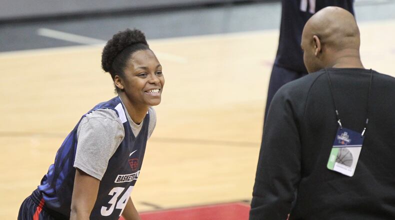 Dayton’s JaVonna Layfield practices with Simon Harris on Thursday, March 15, 2018, at the KFC Yum! Center in Louisville, Ky. David Jablonski/Staff