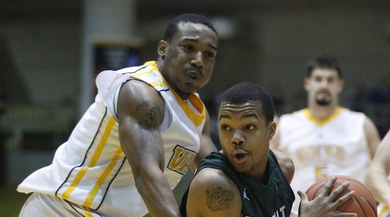 Wright State’s Reggie Arceneaux is guarded by Valparaiso’s LaVonte Dorrity on Tuesday, March 12, 2013, at Valparaiso in the Horizon League championship game. David Jablonski/Staff