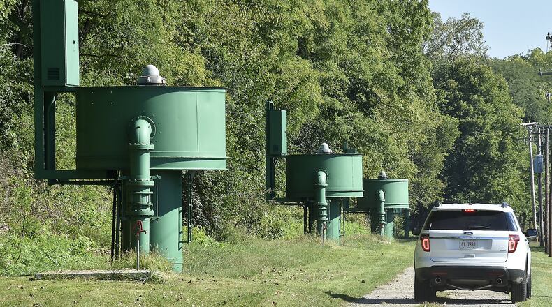 A city of Springfield employee drives past the row of pumps in the city’s fresh water well field along Eagle City Road in 2014.Bill Lackey/Staff