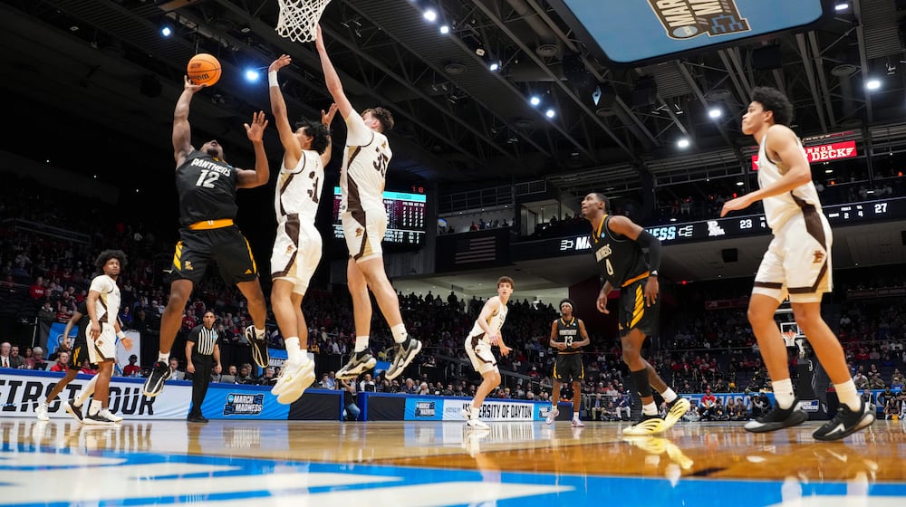 Prairie View A&M guard Lance Williams (12) shoots against Lehigh guard Jalen Vazquez (31) during the first half of a First Four college basketball game in the NCAA Tournament in Dayton, Ohio, Wednesday, March 18, 2026. (AP Photo/Jeff Dean)