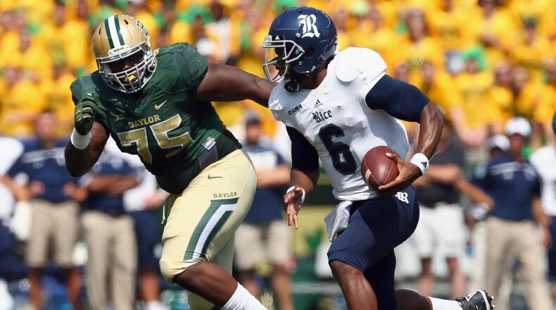 Bengals defensive tackle Andrew Billings, seen here as a Baylor Bear tracking Rice's Driphus Jackson in a 2015 game,  missed his rookie season of 2016 with a knee injury.
