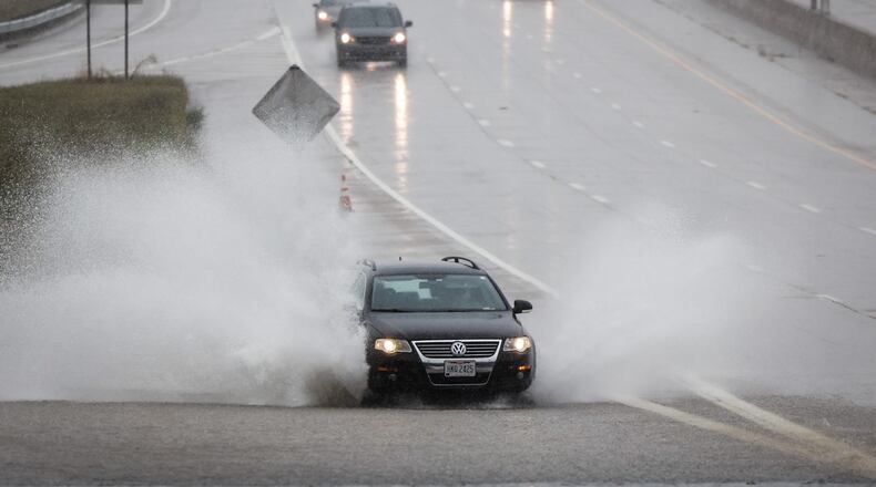 Drivers on SR 35 near James H. McGee Blvd. dodged standing water Tuesday August 31 after remnants hurricane Ida dumped copious amounts of rain in Dayton. JIM NOELKER/STAFF