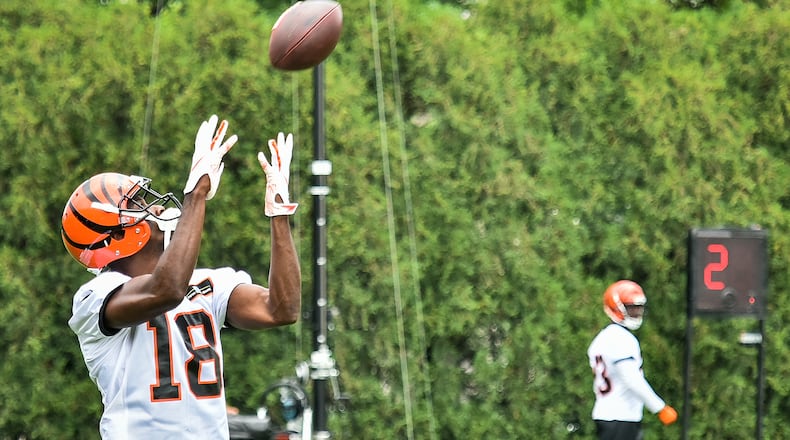 Bengals’ wide receiver A.J. Green catches a pass during organized team activities Tuesday, May 22 at the practice facility near Paul Brown Stadium in Cincinnati. NICK GRAHAM/STAFF