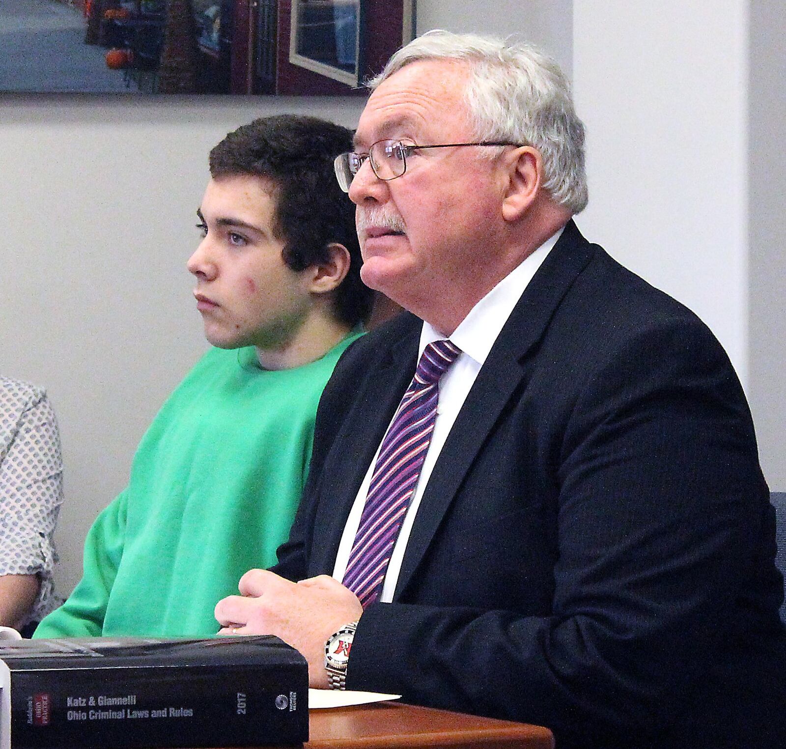 Ely Serna (left) and his attorney, Dennis Lieberman listen to Champaign County Juvenile Court Judge Lori Reisinger during proceedings to determine if Serna is competent to stand trial. JEFF GUERINI/STAFF