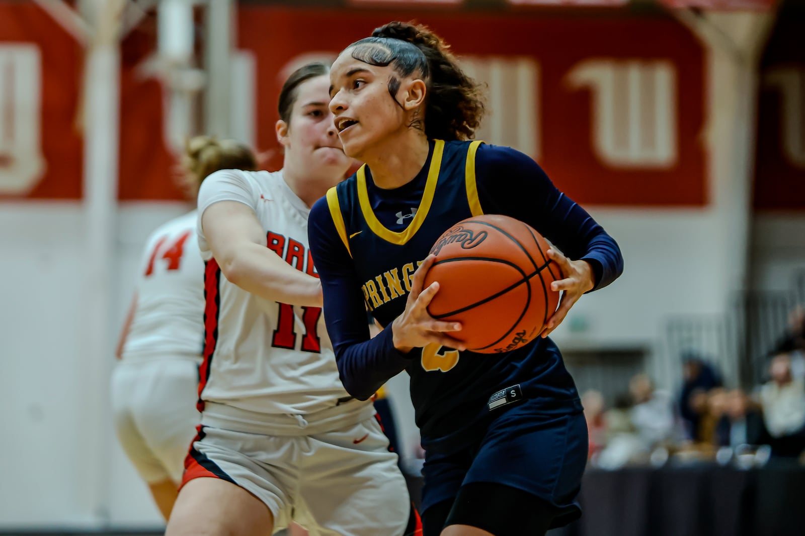 Springfield High School senior Milly Portis drives past Tecumseh senior Katie Kouts during their game on Tuesday night at Wittenberg University's Pam Evans Smith Arena. MICHAEL COOPER / STAFF