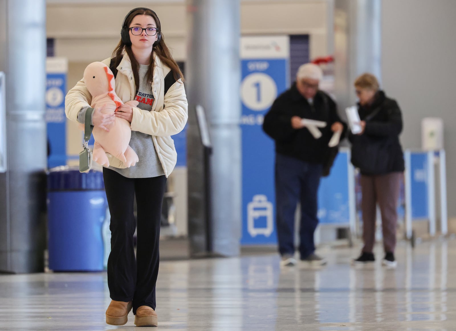 A passenger walks through the terminal at James M. Cox Dayton International Airport on Thursday, Dec. 11. AAA projects 122.4 million Americans will travel at least 50 miles from home over the 13-day year-end holiday period. A record 8.03 million travelers will take domestic flights this holiday season, a 2.3 percent increase compared to last year. BRYANT BILLING/STAFF