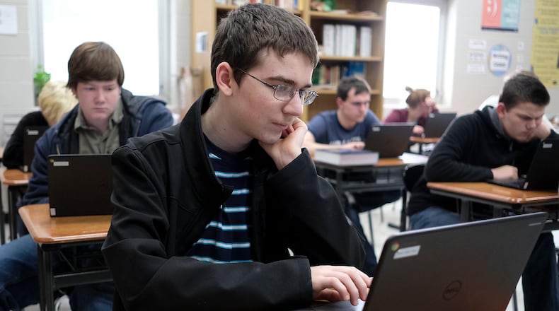 Tyler Wooten, a sophomore at Graham High School studies for an exam in his English class. Bill Lackey/Staff