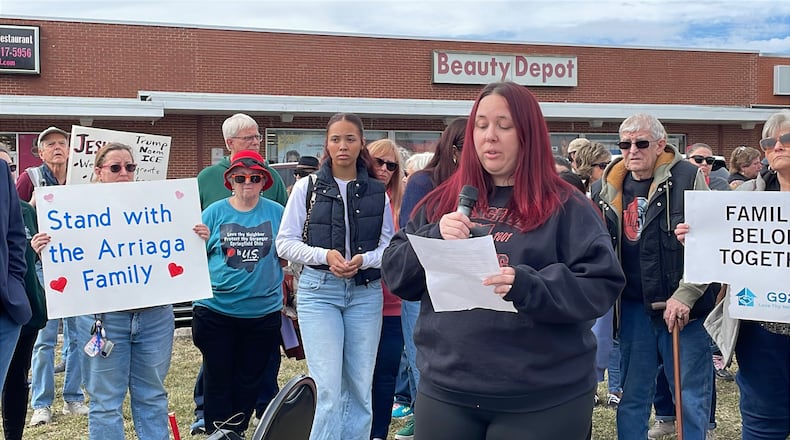 Lacy Arriaga, 37, of Springfield, (center) speaks during a press conference Saturday outside of the Southgate shopping center in Springfield. Local advocates gathered to show support for her family as her husband, Juan Arriaga Reyes, 45, was recently detained by U.S. Immigration and Customs Enforcement (ICE) following his annual check-in with the agency. He is being held at the Butler County Correctional Complex and is expected to be deported back to Mexico soon. SAM WILDOW/STAFF