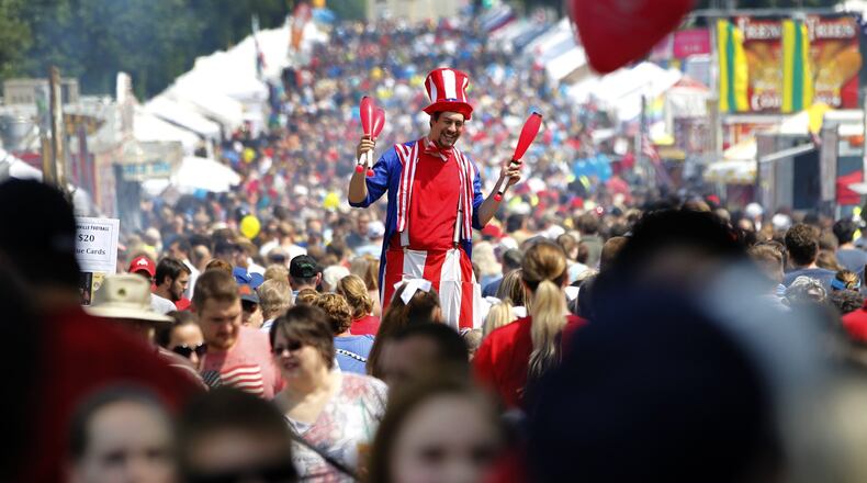 Centerville’s Americana Festival parade makes its way down West Franklin Street. The festival, which was expected to draw over 75,000 people, featured the parade with over 120 units, a 5K run, a street fair and fireworks. LISA POWELL / STAFF
