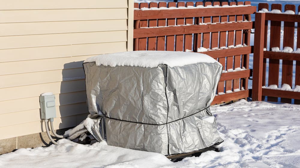 Walk the perimeter of your home and check for anything that might need attention when winterizing, including loose siding, cracked caulking or gaps around vents and foundations. You might also consider covering an outdoor air conditioning unit. ISTOCK
