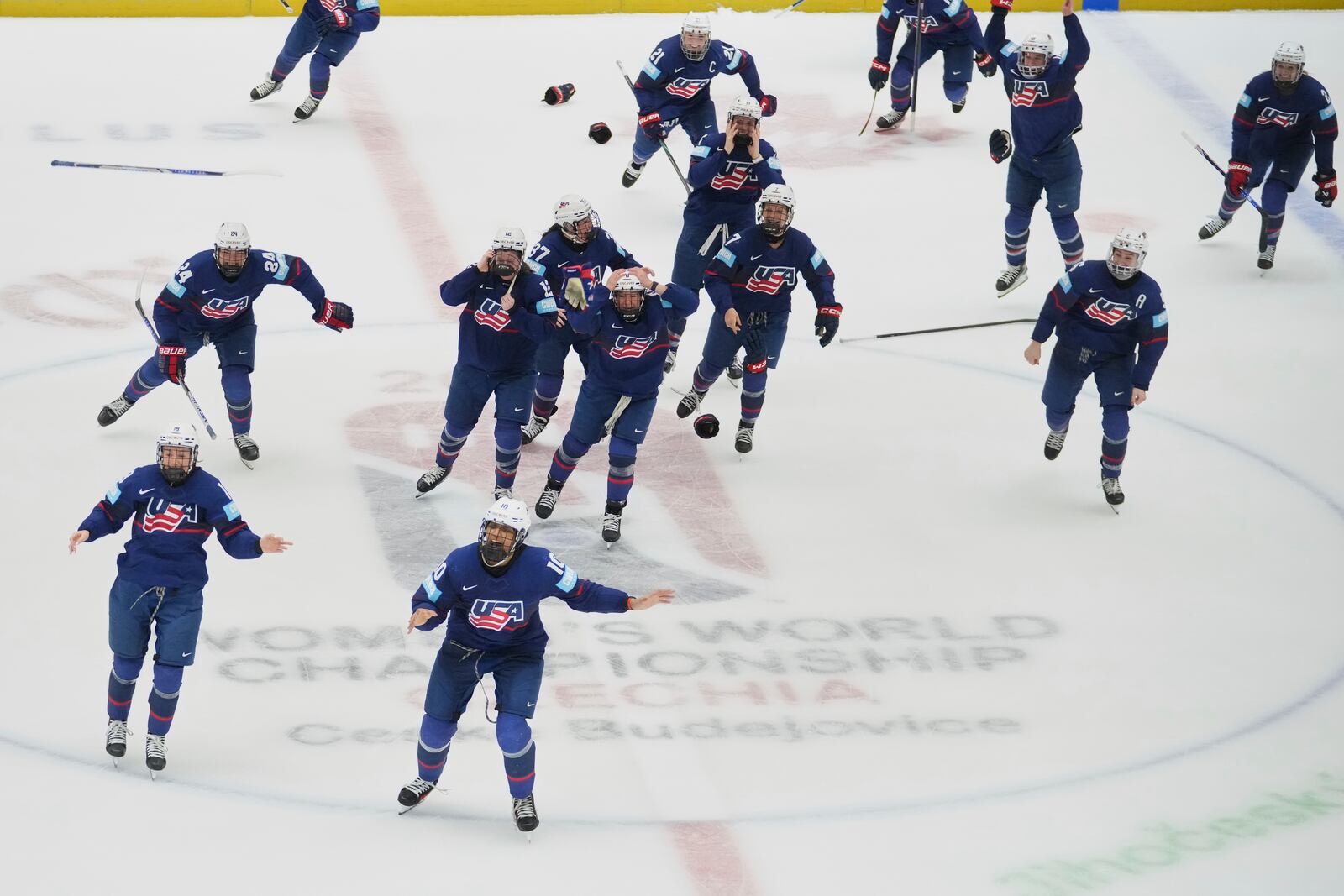 United States players celebrate winning the gold medal match between Canada and United States at the Women's Ice Hockey Championships in Ceske Budejovice, Czech Republic, Sunday, April 20, 2025. (AP Photo/Petr David Josek)