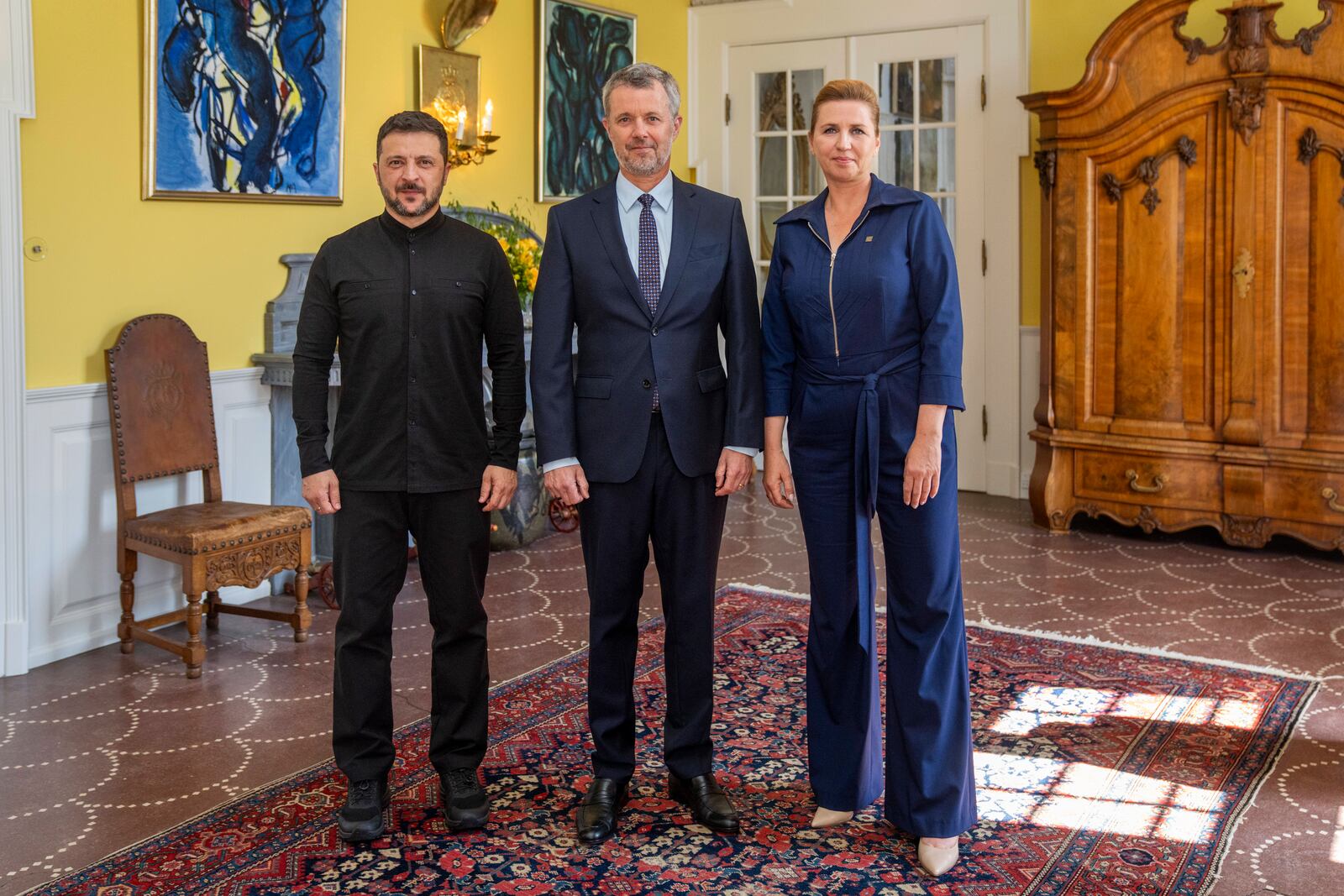 Denmark's King Frederik X receives Ukraine's President Volodymyr Zelenskyy, left, in an audience with Prime Minister Mette Frederiksen, right, at Marselisborg Palace in Aarhus, Denmark, Thursday July 3, 2025. (Ida Marie Odgaard/Ritzau Scanpix via AP)