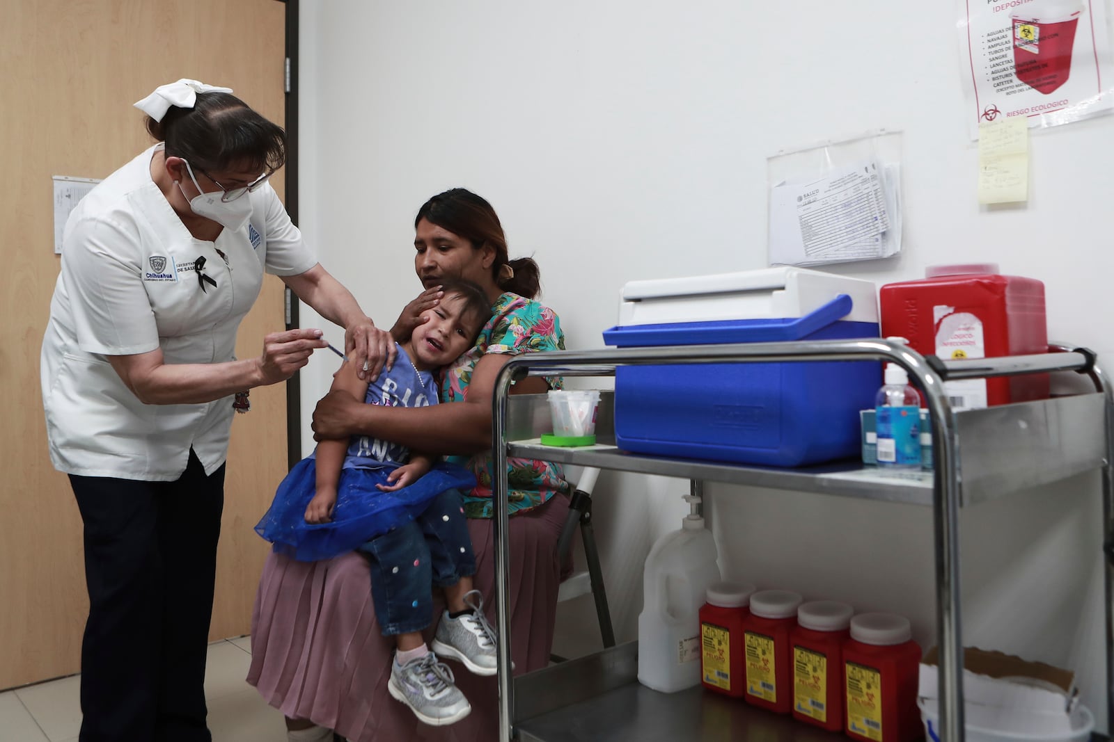 A health worker gives a child a measles vaccine at the health center in Ciudad Juarez, Chihuahua state, Mexico, Wednesday, April 30, 2025. (AP Photo/Christian Chavez)