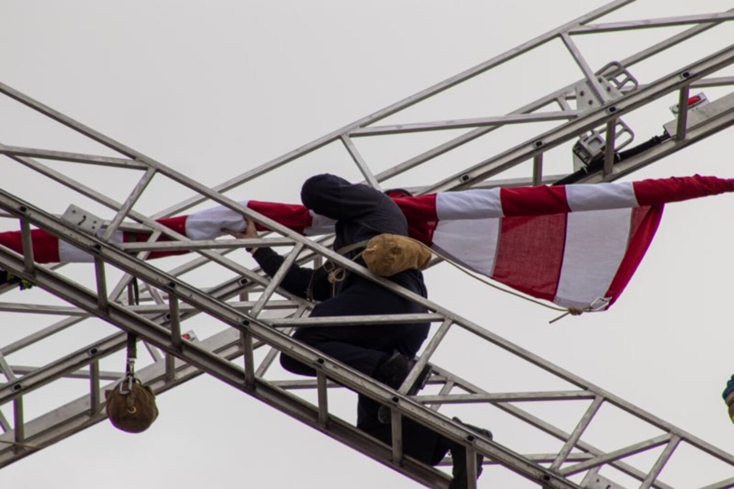 Firefighters put U.S. flag across Third Street