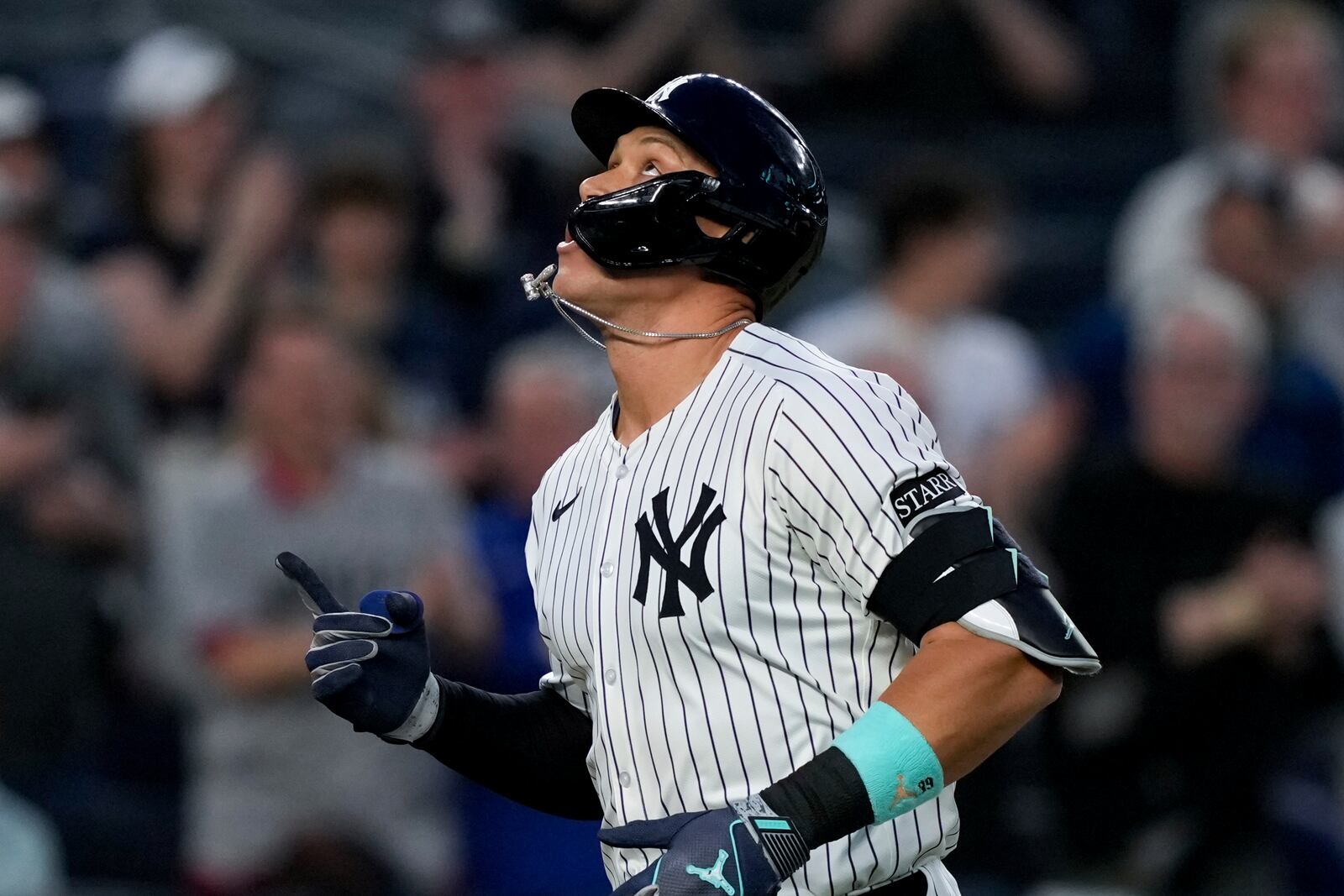 New York Yankees' Aaron Judge runs to home plate after homering on a fly ball to right center field, his 500th extra base hit, during the first inning of a baseball game against the Arizona Diamondbacks, Thursday, April 3, 2025, in New York. (AP Photo/Julia Demaree Nikhinson)