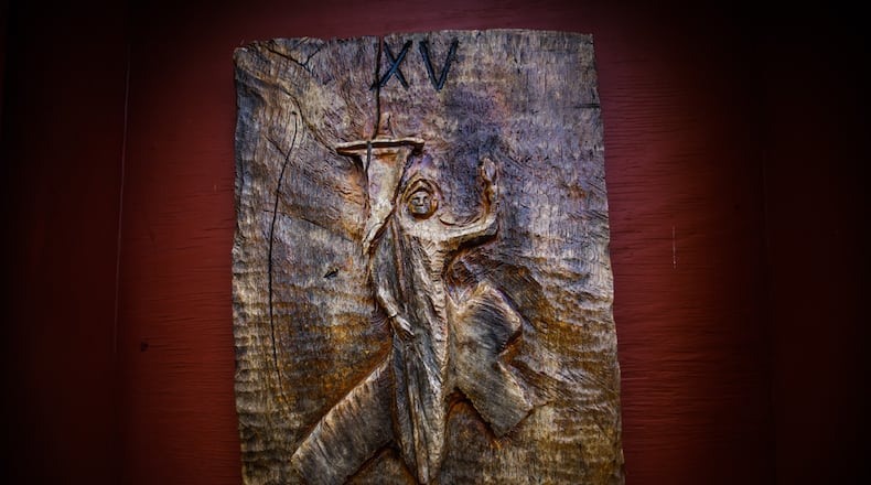 The way of the Cross wooden sculptures line pathway around the Lange Estate on Calumet Road in West Milton. The estate has been transformed into the Transfiguration Center for Spiritual Renewal. The stations on the site were hand carved by local woodcarver, John Bookwalter. JIM NOELKER/STAFF