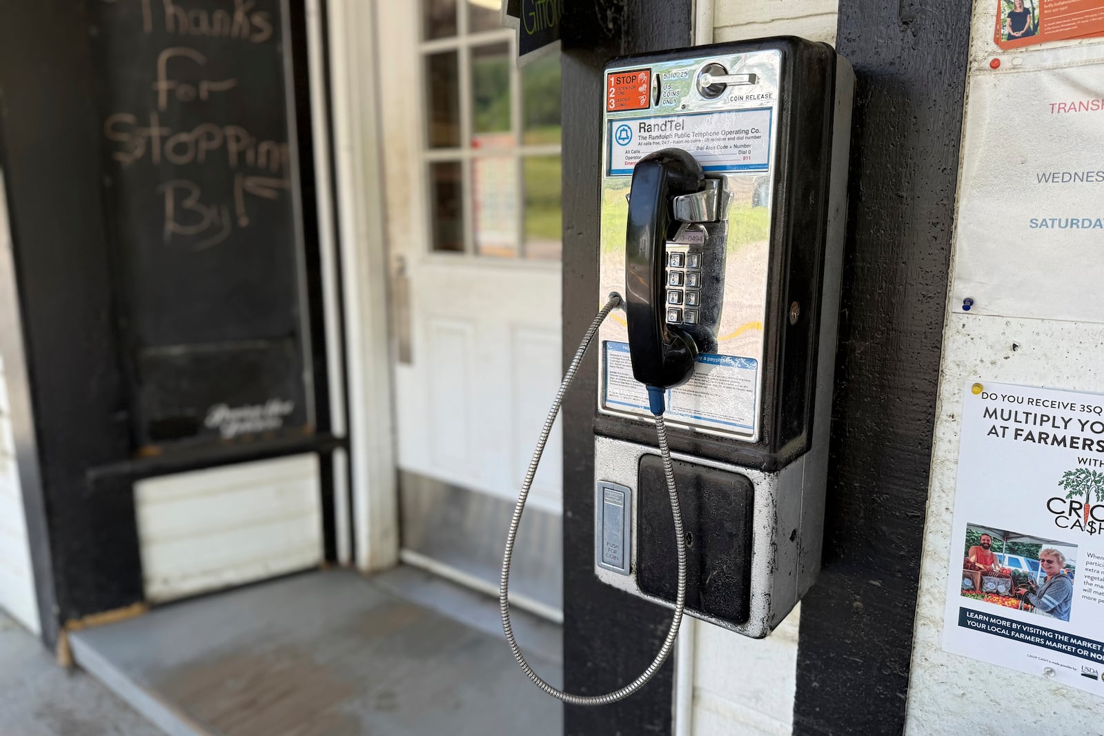 A phone installed by engineer Patrick Schlott is pictured outside the North Tunbridge General Store on July 16, 2025, in Tunbridge, Vt. (AP Photo/Amanda Swinhart)