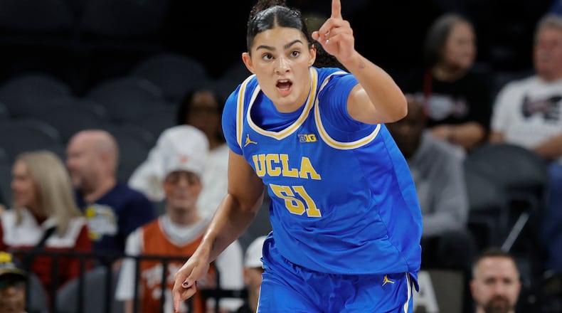 UCLA center Lauren Betts (51) reacts after making a basket against Texas during the first half of an NCAA college basketball game in the Players Era tournament Wednesday, Nov. 26, 2025, in Las Vegas. (AP Photo/Steve Marcus)