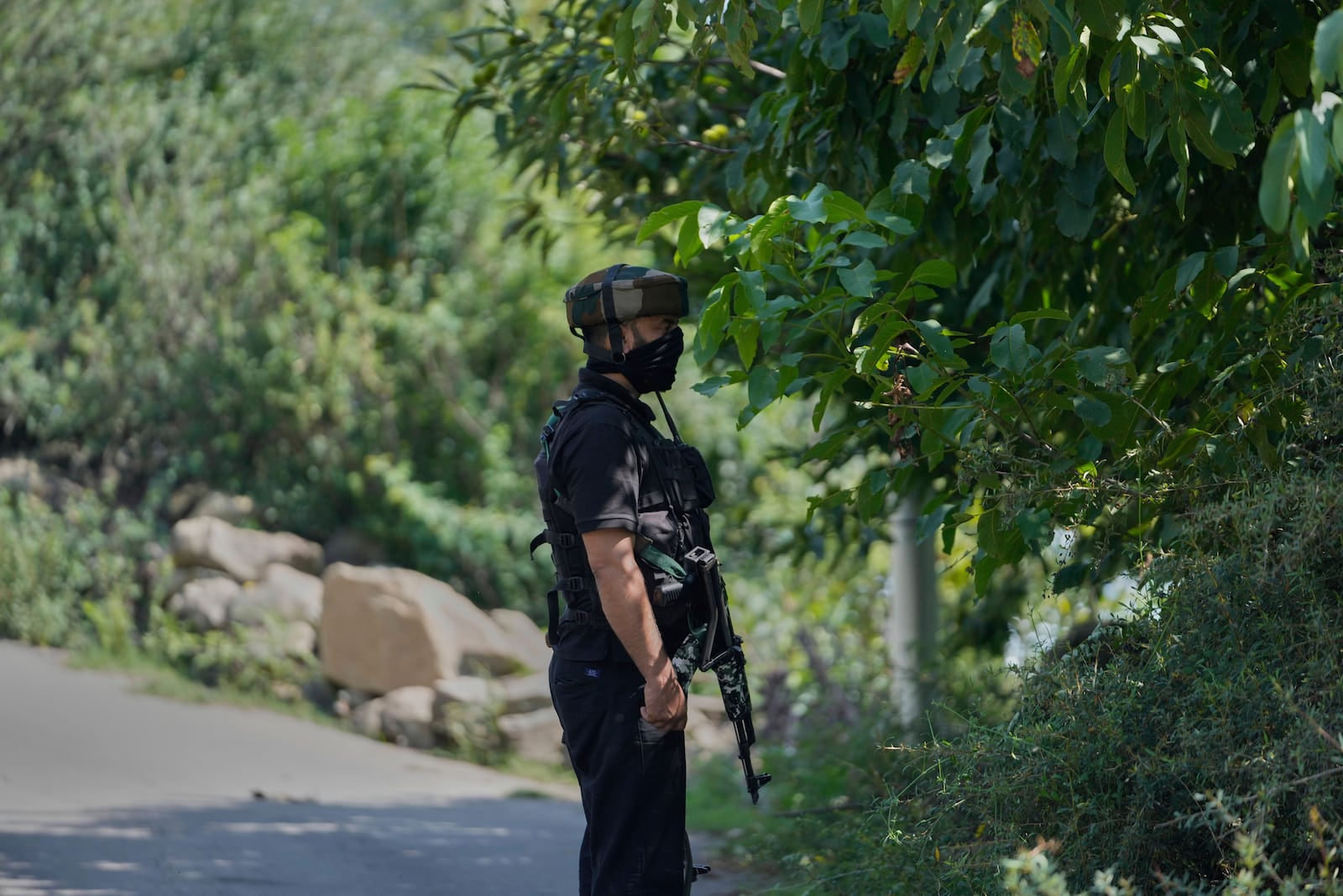 Jammu and Kashmir Special Operation Group (SOG) personnel guard near the site of a gun battle on the outskirts of Srinagar, Indian controlled Kashmir, Monday, July 28, 2025. (AP Photo/Mukhtar Khan)