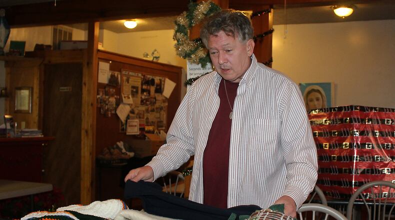 Fred Stegner with the Springfield Soup Kitchen makes sure blankets, hats and gloves are available for the coming winter season. JEFF GUERINI/STAFF