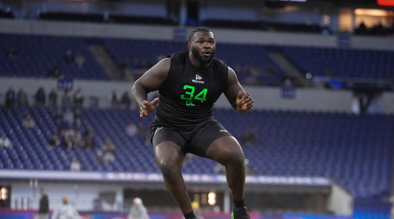 Miami offensive lineman Jalen Rivers runs a drill at the NFL football scouting combine in Indianapolis, Sunday, March 2, 2025. (AP Photo/Michael Conroy)