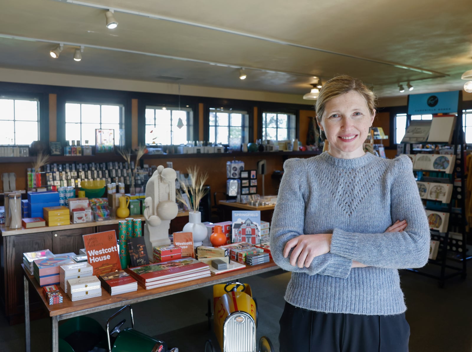 Executive director and curator Marta Wojcik in the garage of Frank Lloyd Wright's Westcott House on Thursday, April 17, 2025. JOSEPH COOKE/STAFF