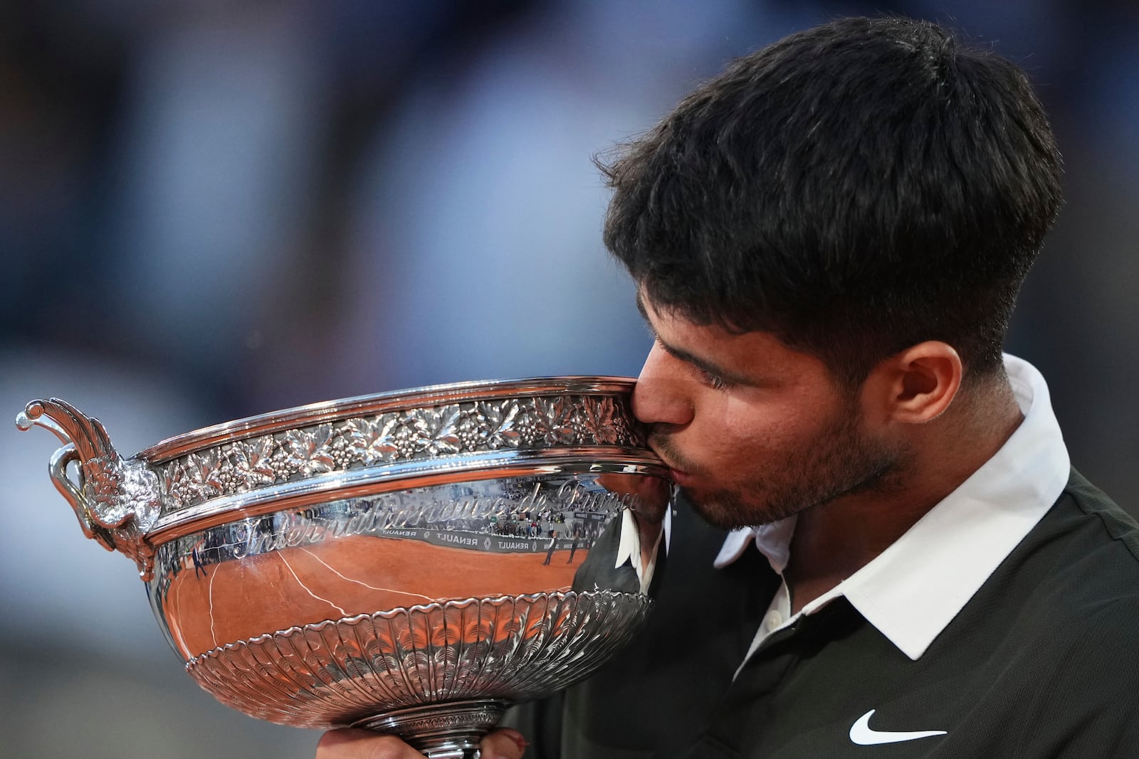 Spain's Carlos Alcaraz celebrates with the trophy after winning the final match of the French Tennis Open against Italy's Jannik Sinner at the Roland-Garros stadium in Paris, Sunday, June 8, 2025. (AP Photo/Lindsey Wasson)