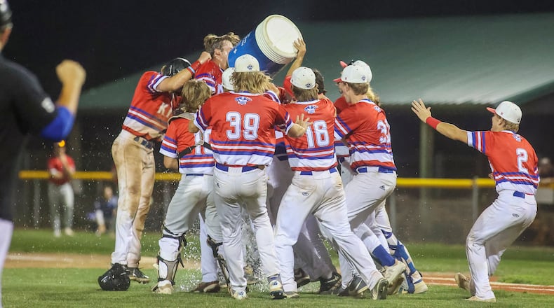 The Champion City Kings celebrate after beating the Chillicothe Paints 10-9 in 2021 at Carleton Davidson Stadium in Springfield to win their first-ever Prospect League Ohio River Valley Division Championship. Photo by Michael Cooper