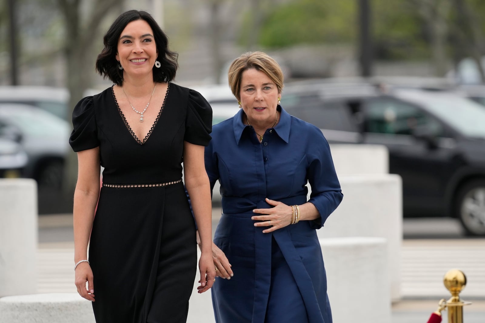 Massachusetts Gov. Maura Healey, right, and her partner, Joanna Lydgate, arrive at the JFK Library, Sunday, May 4, 2025, in Boston. (AP Photo/Robert F. Bukaty)