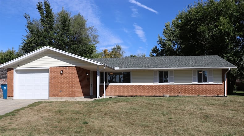 Located within an established neighborhood of Huber Heights, this brick ranch at 6119 Buckman Drive has about 1,303 square feet of living space. Contributed photos by Kathy Tyler