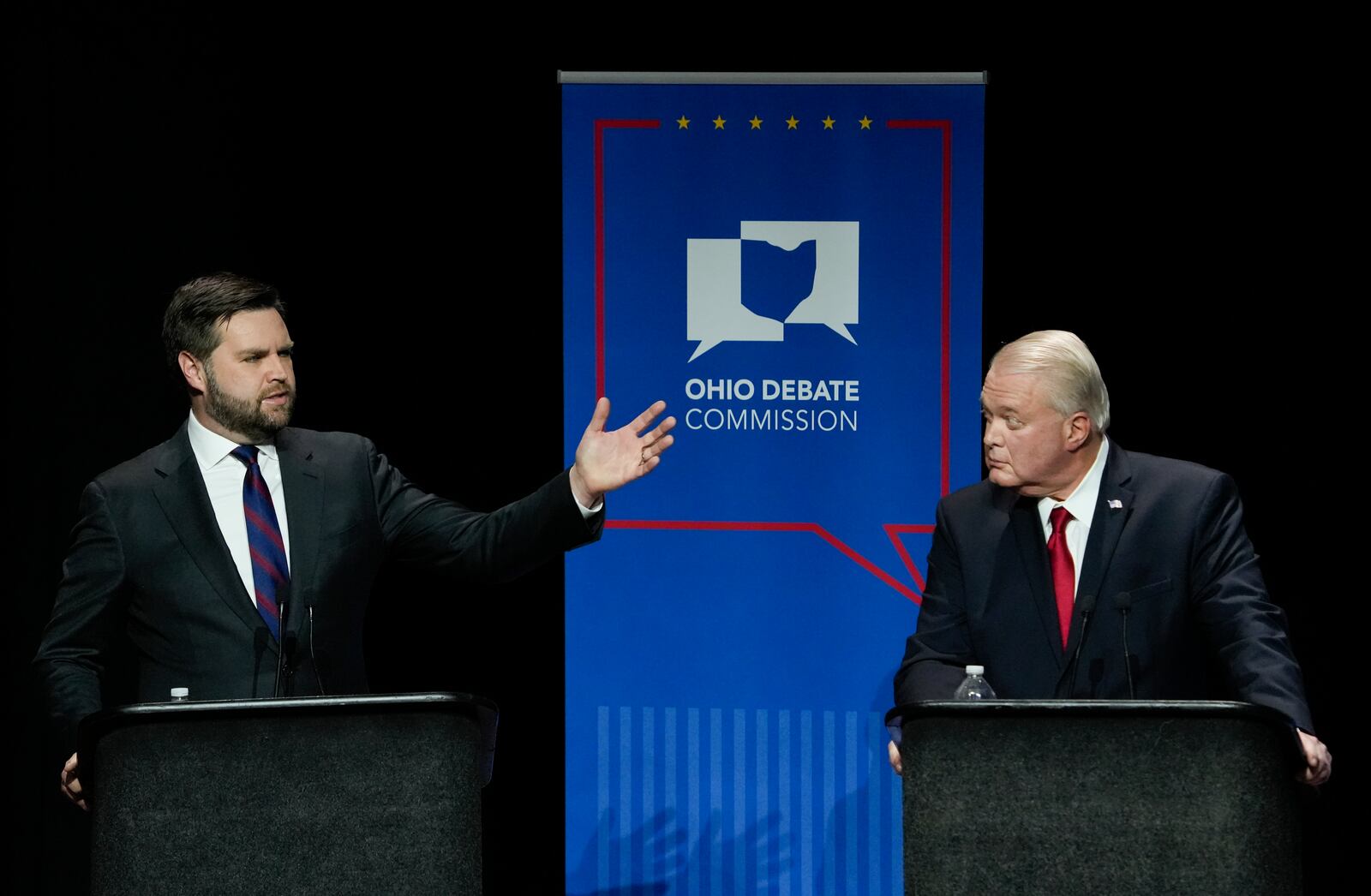 Mar 28, 2022; Wilberforce, Ohio, USA; U.S. Senate Republican candidate J.D. Vance, left, makes a point as fellow candidate Mike Gibbons listens during Ohio’s U.S. Senate Republican Primary Debate at Central State University. Mandatory Credit: Joshua A. Bickel/Ohio Debate Commission